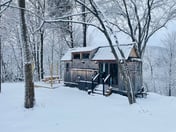 Caboose Tiny Home on river with hot tub near Stowe